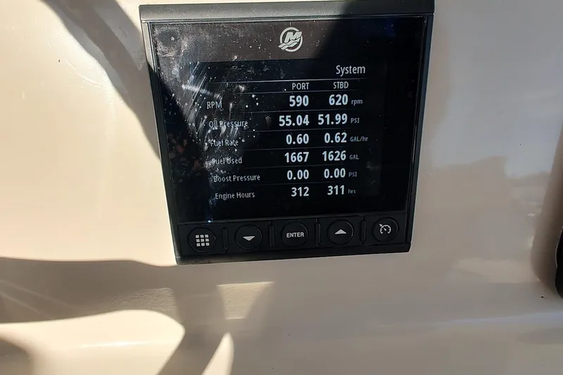  Yacht Photos Pics Display screen on 2019 Boston Whaler 330 Outrage showing engine metrics and system data.
