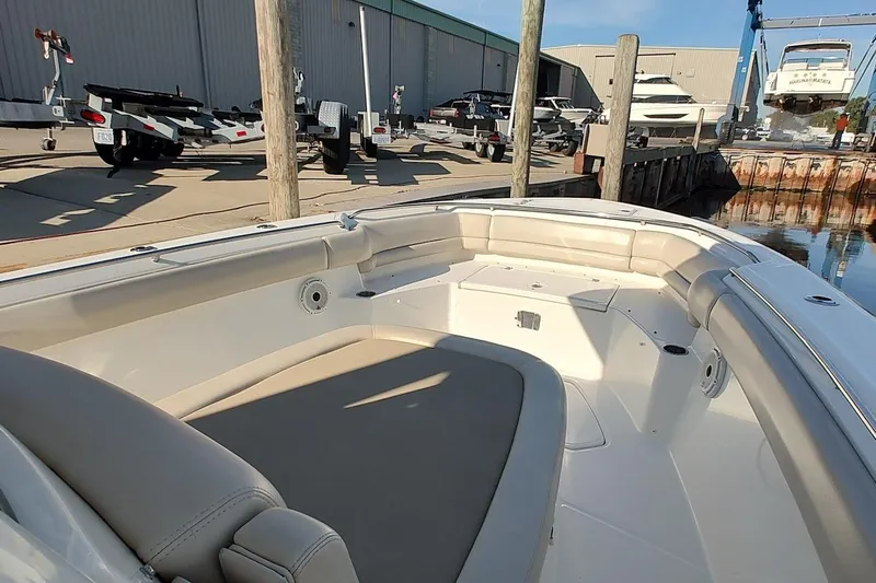  Yacht Photos Pics 2019 Boston Whaler 330 Outrage boat interior at marina with trailers and boats.