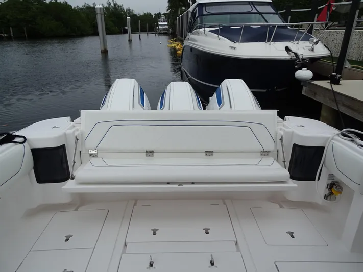  Yacht Photos Pics 2022 Intrepid 407 Panacea boat docked with triple outboard engines.
