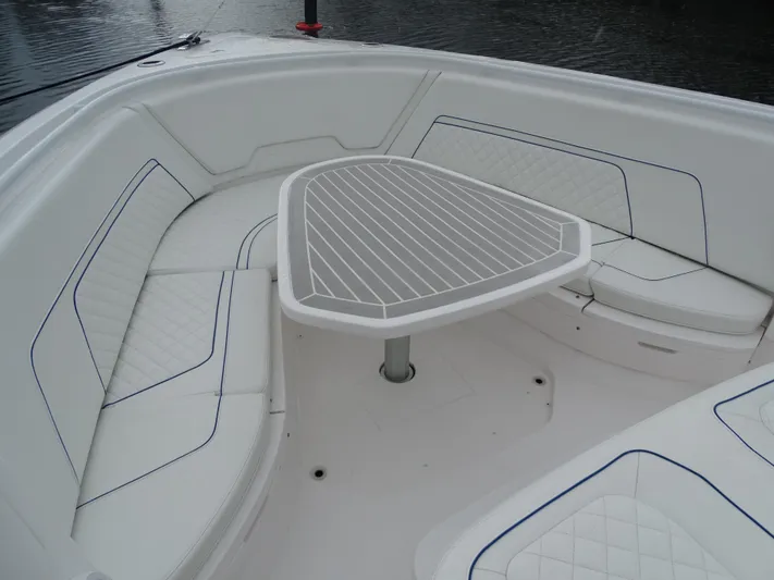  Yacht Photos Pics Luxurious seating area on 2022 Intrepid 407 Panacea boat with sleek table design.