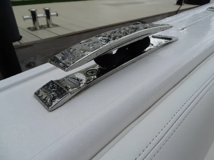  Yacht Photos Pics Close-up of a 2022 Intrepid 407 Panacea boat cleat with water droplets.