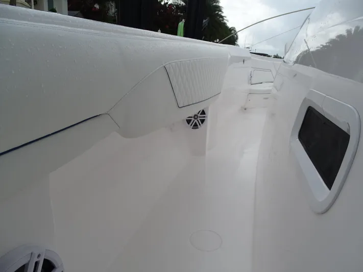  Yacht Photos Pics 2022 Intrepid 407 Panacea boat interior with sleek white design and modern features.