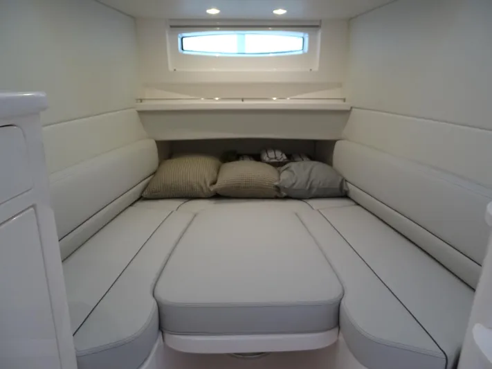 Yacht Photos Pics Luxurious cabin interior of 2022 Intrepid 407 Panacea with plush seating and cushions.