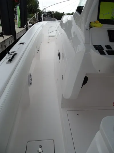  Yacht Photos Pics 2022 Intrepid 407 Panacea boat interior with sleek white design and modern controls.