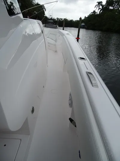  Yacht Photos Pics 2022 Intrepid 407 Panacea boat docked on a calm river.