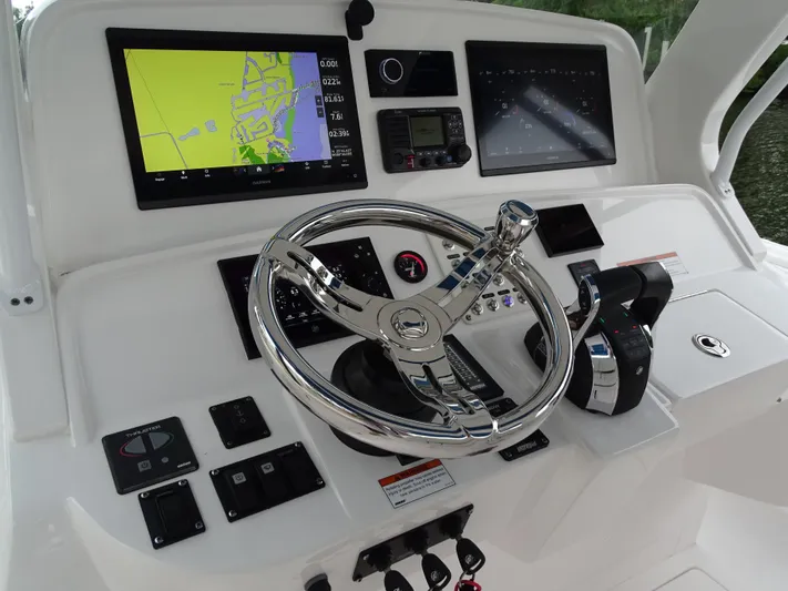  Yacht Photos Pics Intrepid 407 Panacea 2022 helm with navigation screens and controls.