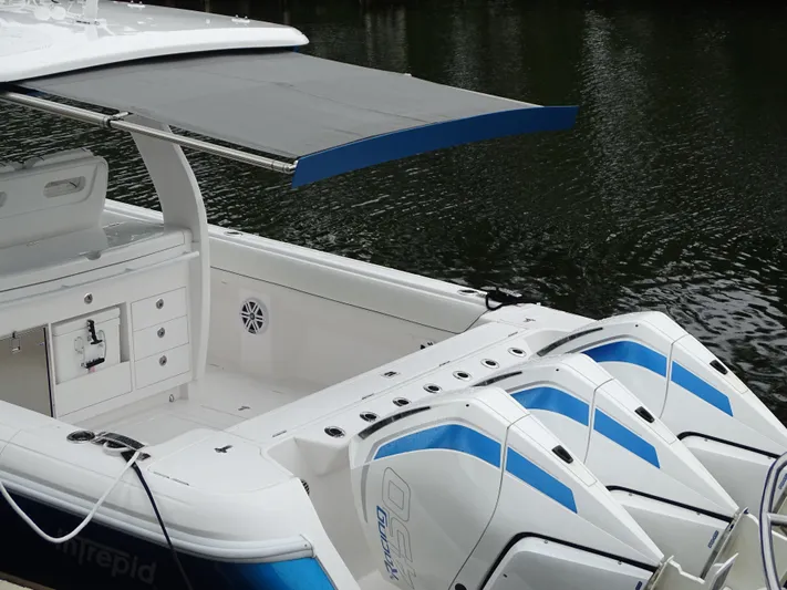  Yacht Photos Pics 2022 Intrepid 407 Panacea boat with triple engines and sleek design on water.
