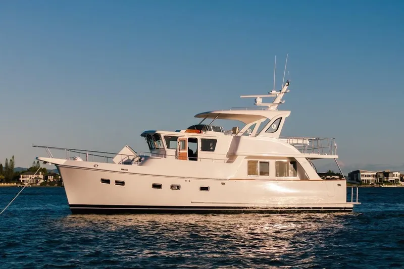  Yacht Photos Pics 2024 Selene 49 yacht on calm water under clear blue sky.