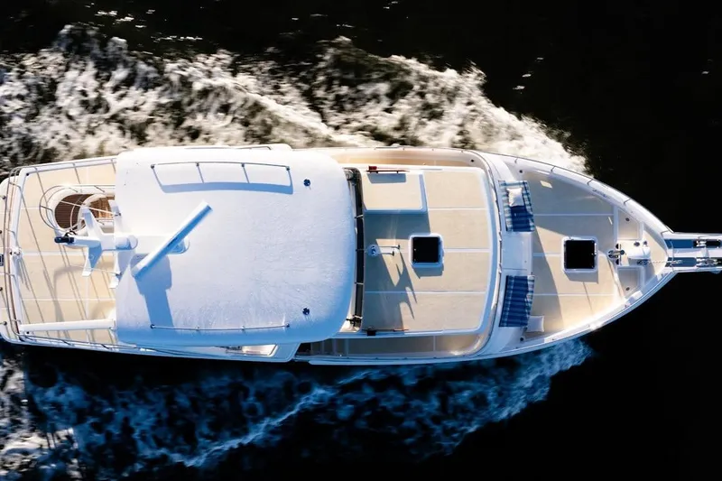  Yacht Photos Pics Aerial view of 2024 Selene 49 yacht cruising on water, showcasing sleek design.