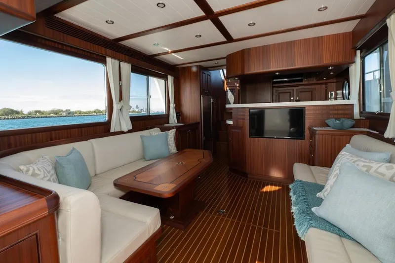  Yacht Photos Pics Luxurious interior of 2024 Selene 49 yacht with elegant wood finish and comfortable seating.
