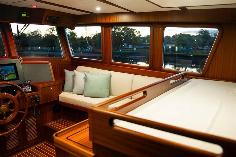  Yacht Photos Pics Luxurious interior of 2024 Selene 49 yacht with plush seating and wooden accents.