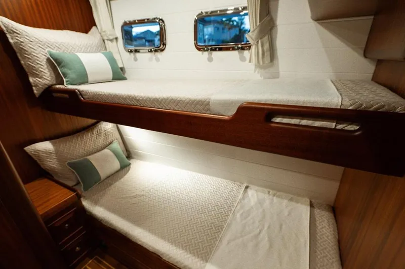  Yacht Photos Pics 2024 Selene 49 yacht interior with cozy bunk beds and nautical decor.