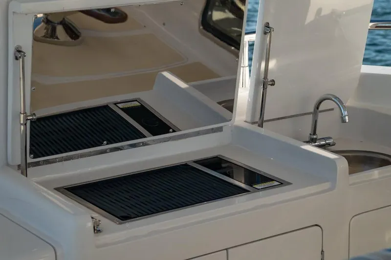  Yacht Photos Pics Outdoor kitchen on 2024 Selene 49 yacht with grill and sink.