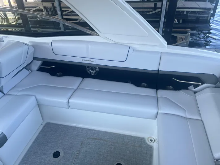  Yacht Photos Pics 2023 Formula 310 Bowrider I/O interior with white seating and sleek design.