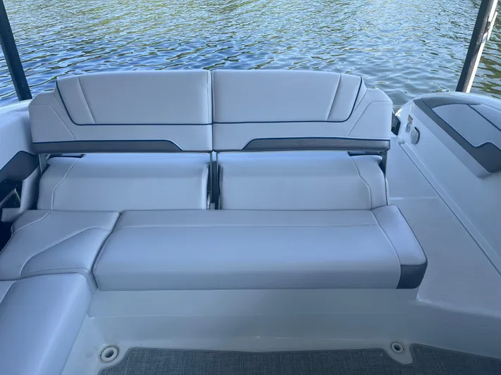 Yacht Photos Pics 2023 Formula 310 Bowrider I/O boat interior with sleek seating by the water.