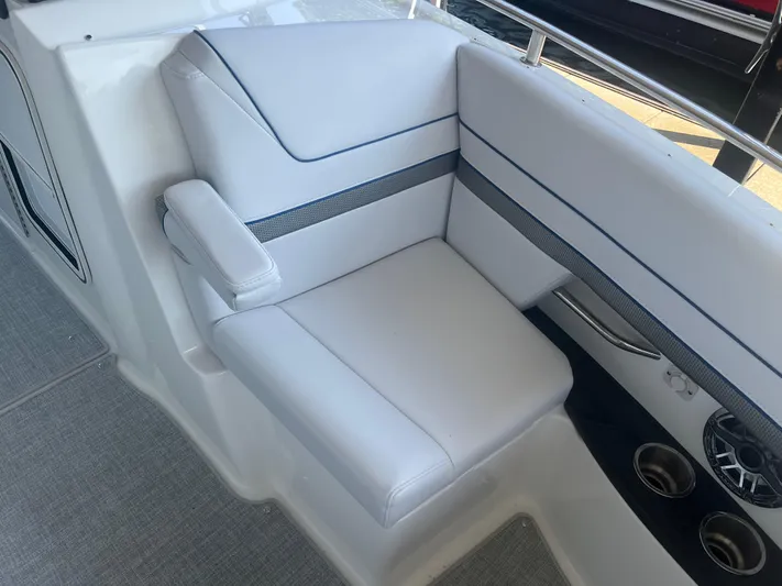  Yacht Photos Pics 2023 Formula 310 Bowrider I/O interior seating with white upholstery and cup holders.