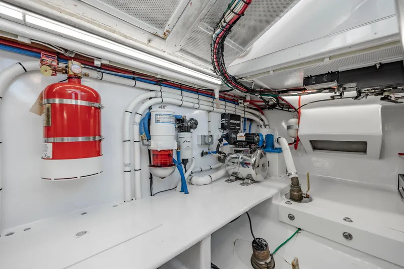 Nuts And Bolts Yacht Photos Pics Engine room of a 1998 Scopinich Custom Express boat with fire extinguisher and wiring.