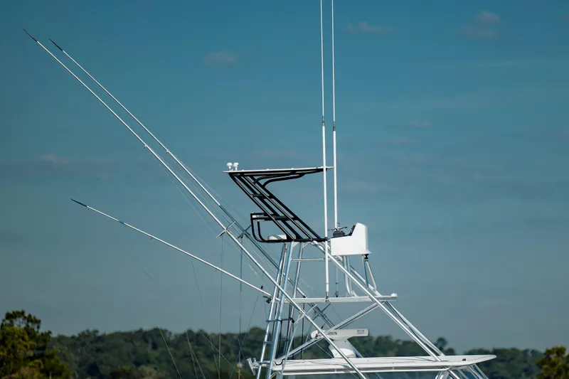 Nuts And Bolts Yacht Photos Pics 1998 Scopinich Custom Express boat tower with antennas against blue sky