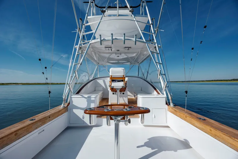 Nuts And Bolts Yacht Photos Pics 1998 Scopinich Custom Express boat with fishing setup on calm water.