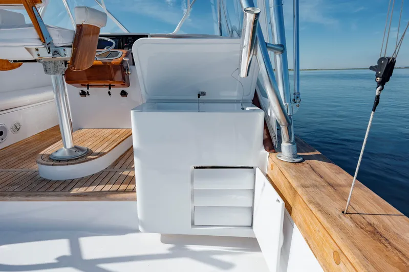 Nuts And Bolts Yacht Photos Pics 1998 Scopinich Custom Express boat interior with wooden accents and open storage compartment.