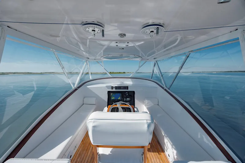 Nuts And Bolts Yacht Photos Pics 1998 Scopinich Custom Express boat interior with white seating and panoramic water view.