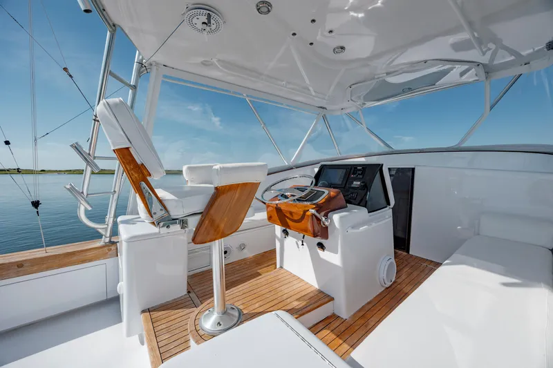 Nuts And Bolts Yacht Photos Pics 1998 Scopinich Custom Express boat interior with wooden accents and modern controls.