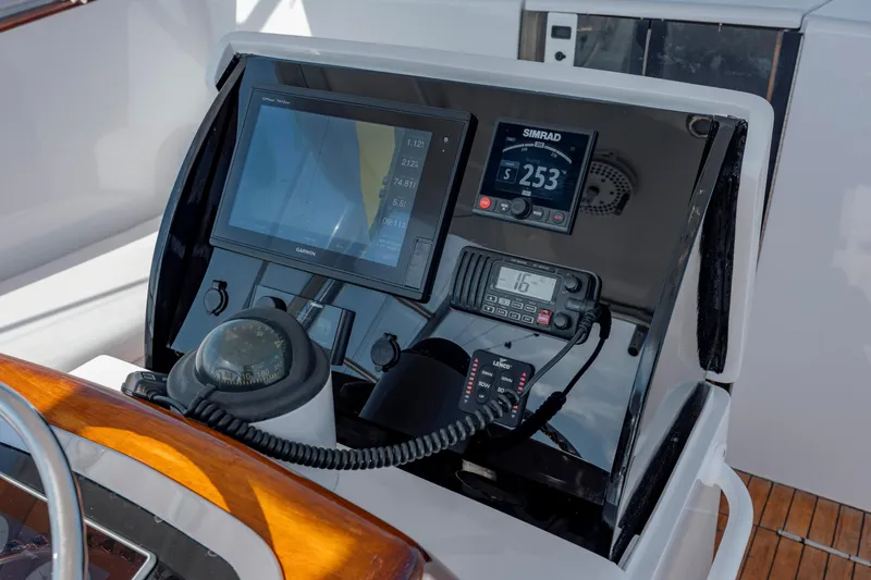 Nuts And Bolts Yacht Photos Pics 1998 Scopinich Custom Express boat dashboard with navigation and communication equipment.