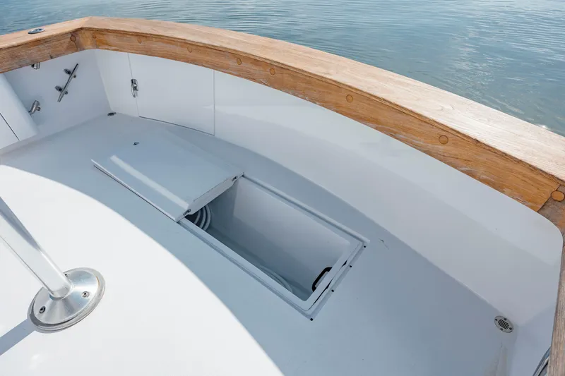 Nuts And Bolts Yacht Photos Pics 1998 Scopinich Custom Express boat deck with open storage compartment.