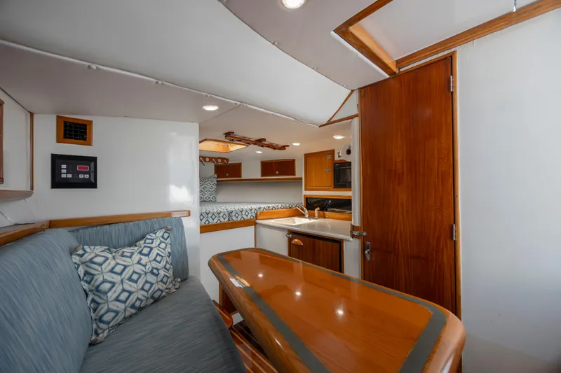 Nuts And Bolts Yacht Photos Pics 1998 Scopinich Custom Express yacht interior with wooden finishes and modern amenities.