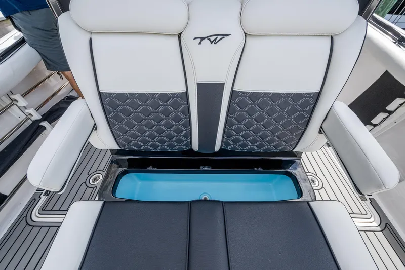 Floating Stones Yacht Photos Pics 2022 Tidewater 292 CC Adventure boat seat with storage compartment open.