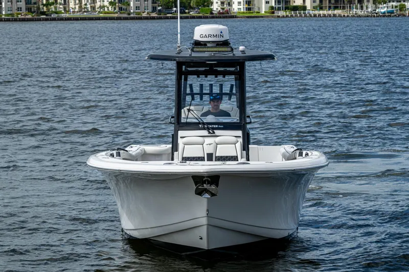 Floating Stones Yacht Photos Pics 2022 Tidewater 292 CC Adventure boat on water, front view with Garmin equipment.