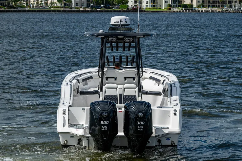 Floating Stones Yacht Photos Pics 2022 Tidewater 292 CC Adventure boat with dual Yamaha engines on water.