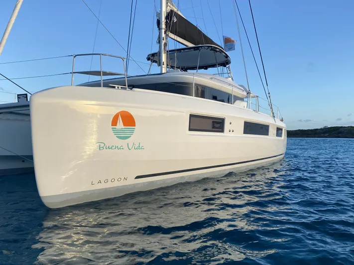 Buena Vida Yacht Photos Pics 2023 Lagoon 50 catamaran "Buena Vida" sailing on calm blue waters.