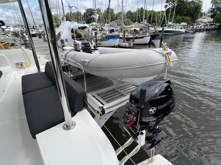 Buena Vida Yacht Photos Pics 2023 Lagoon 50 yacht with Tohatsu motor and dinghy at marina.