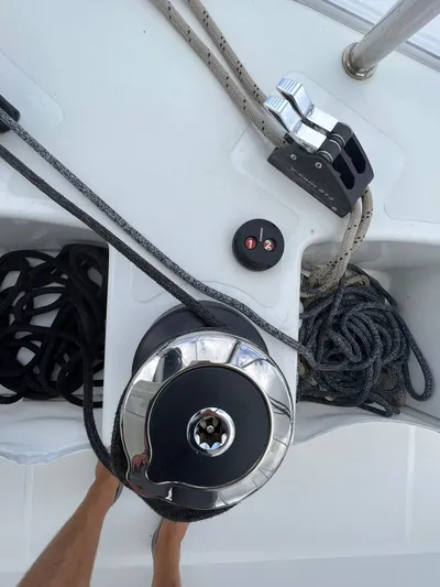 Buena Vida Yacht Photos Pics 2023 Lagoon 50 yacht deck with winch, ropes, and cleat.