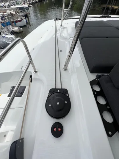 Buena Vida Yacht Photos Pics Deck view of 2023 Lagoon 50 catamaran with rigging and seating area.