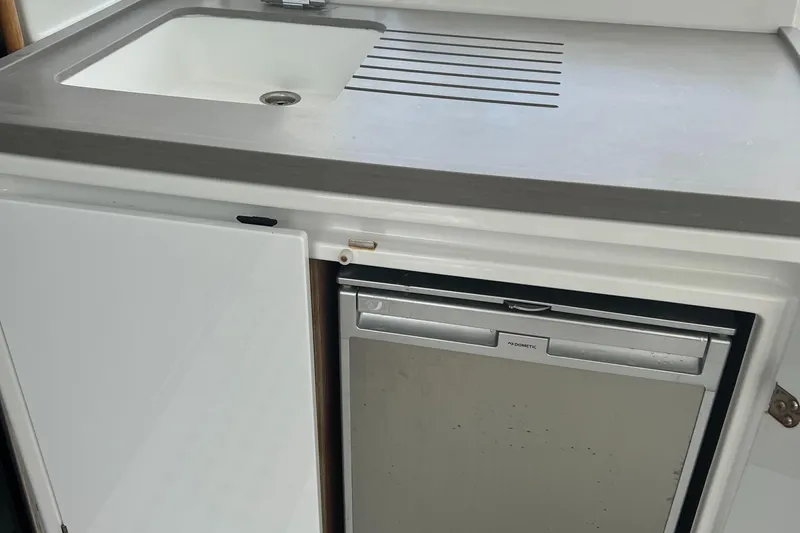 Buena Vida Yacht Photos Pics 2023 Lagoon 50 yacht kitchen with sink and compact refrigerator.