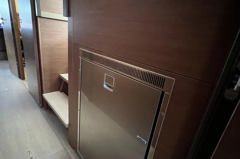 Buena Vida Yacht Photos Pics Interior of 2023 Lagoon 50 yacht, featuring sleek wooden cabinetry and modern design.