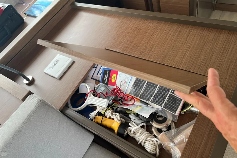 Buena Vida Yacht Photos Pics Storage compartment in 2023 Lagoon 50 yacht with ropes and accessories.