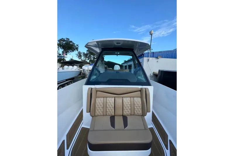  Yacht Photos Pics 2025 Monterey Elite 27 OB boat with luxurious seating and sleek design.