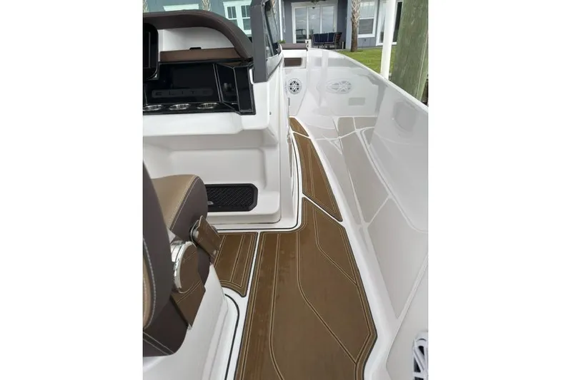  Yacht Photos Pics 2025 Monterey Elite 27 OB boat interior with sleek brown flooring and modern design.