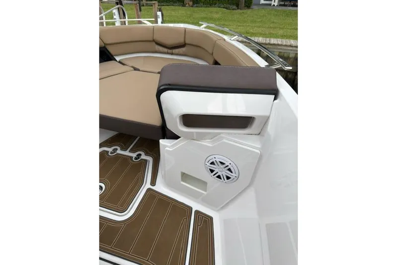  Yacht Photos Pics 2025 Monterey Elite 27 OB boat interior with tan seating and speaker system.