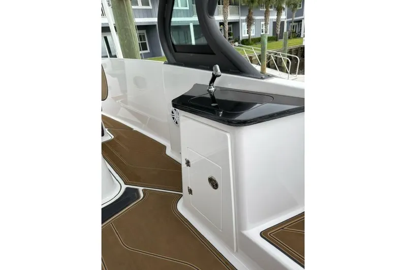  Yacht Photos Pics 2025 Monterey Elite 27 OB boat interior with sleek sink and modern design.