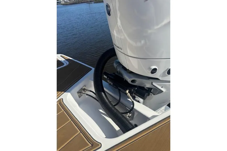  Yacht Photos Pics 2025 Monterey Elite 27 OB boat engine detail by the water.