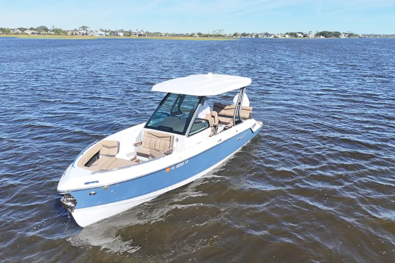  Yacht Photos Pics 2025 Monterey Elite 27 OB boat cruising on open water.