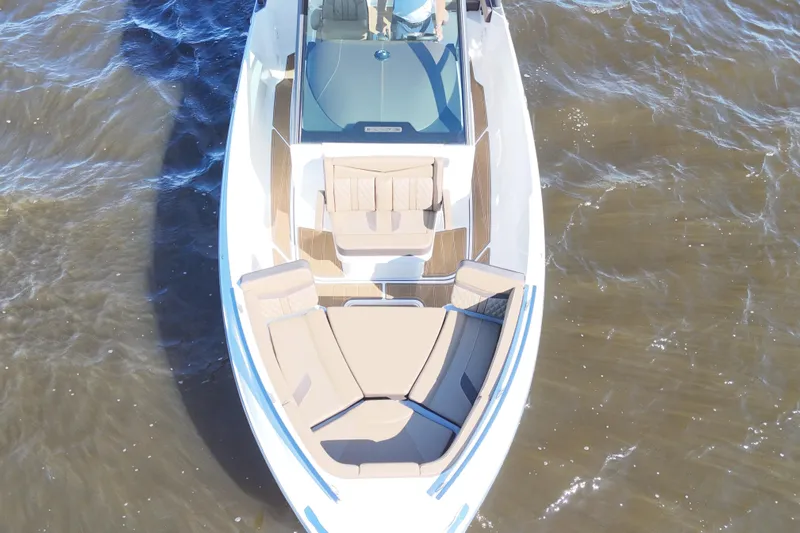  Yacht Photos Pics 2025 Monterey Elite 27 OB boat on water, featuring spacious seating and sleek design.