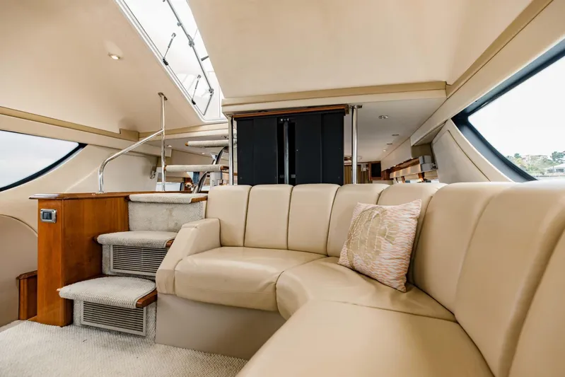Sonshine Yacht Photos Pics Luxurious interior of 2004 Carver 56 Voyager yacht with beige leather seating.