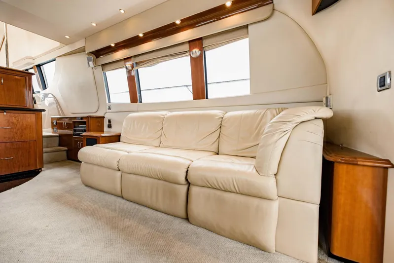 Sonshine Yacht Photos Pics Luxurious interior of 2004 Carver 56 Voyager yacht with beige leather sofa.