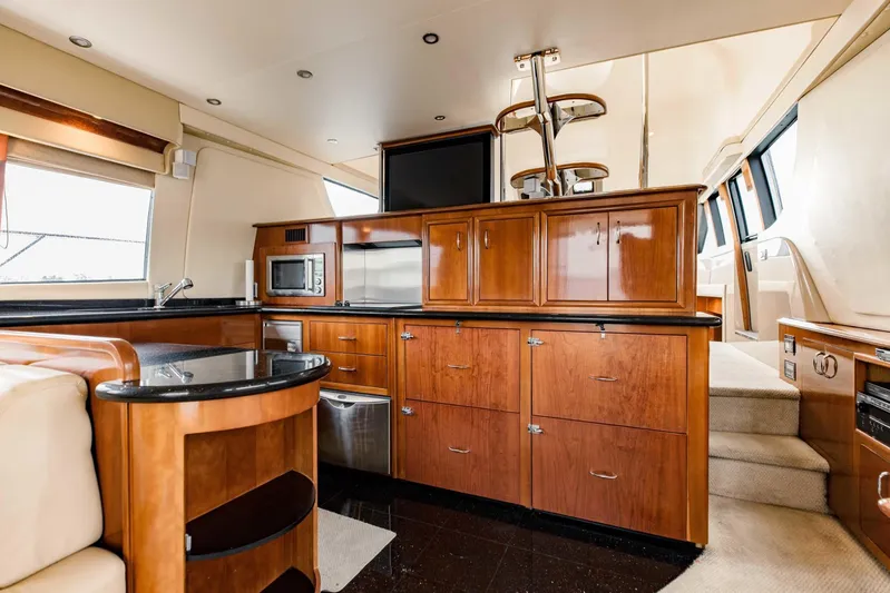 Sonshine Yacht Photos Pics Luxurious interior of a 2004 Carver 56 Voyager yacht with modern kitchen amenities.