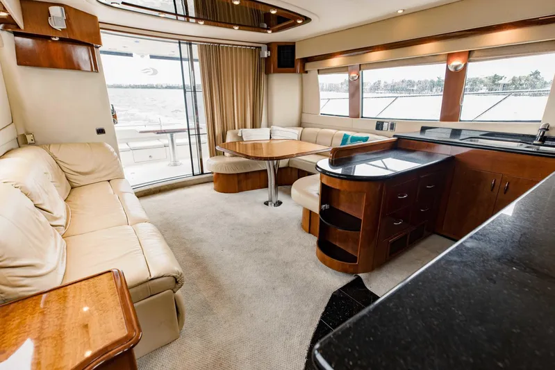 Sonshine Yacht Photos Pics Luxurious interior of 2004 Carver 56 Voyager yacht with elegant seating and dining area.